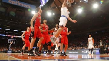 Apr 16, 2014; New York, NY, USA; New York Knicks center Cole Aldrich (45) drives to the basket for a dunk during the second half against the Toronto Raptors at Madison Square Garden. New York Knicks defeat the Toronto Raptors 95-92. Mandatory Credit: Jim O