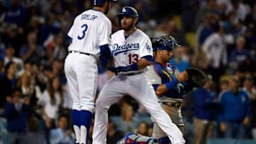 LOS ANGELES, CA - JUNE 13: Max Muncy #13 of the Los Angeles Dodgers hit a two run home run with Chris Taylor #3 with Willson Contreras #40 of the Chicago Cubs in the background during the fourth inning to at Dodger Stadium on June 13, 2019 in Los Angeles, California. (Photo by Kevork Djansezian/Getty Images)
