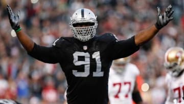 Dec 7, 2014; Oakland, CA, USA; Oakland Raiders defensive end Justin Tuck (91) celebrates after a sack against the San Francisco 49ers during the fourth quarter at O.co Coliseum. The Oakland Raiders defeated the San Francisco 49ers 24-13. Mandatory Credit: Kelley L Cox-USA TODAY Sports