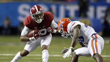 Dec 5, 2015; Atlanta, GA, USA; Alabama Crimson Tide wide receiver ArDarius Stewart (13) runs the ball against Florida Gators defensive back Marcus Maye (20) during the third quarter of the 2015 SEC Championship Game at the Georgia Dome. Mandatory Credit: Jason Getz-USA TODAY Sports