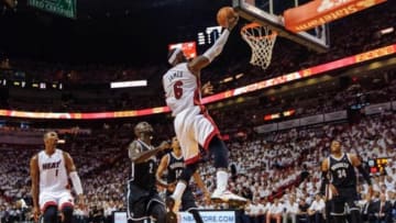 May 6, 2014; Miami, FL, USA; Miami Heat forward LeBron James (6) drives to the basket as Brooklyn Nets center Kevin Garnett (2) defends during the first half in game one of the second round of the 2014 NBA Playoffs at American Airlines Arena. Mandatory Credit: Steve Mitchell-USA TODAY Sports