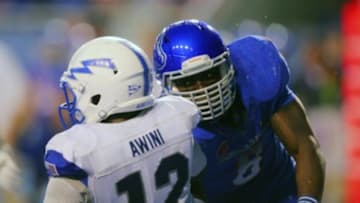 Sep 13, 2013; Boise, ID, USA; Boise State Broncos defensive end Demarcus Lawrence (8) tackles Air Force Falcons quarterback Jaleel Awini (12) during the second half at Bronco Stadium. Boise State defeated the Air Force 42-20. Mandatory Credit: Brian Losness-USA TODAY Sports