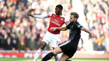 LONDON, ENGLAND - DECEMBER 22: Ainsley Maitland-Niles of Arsenal is challenged by Charlie Taylor of Burnley during the Premier League match between Arsenal FC and Burnley FC at Emirates Stadium on December 22, 2018 in London, United Kingdom. (Photo by Julian Finney/Getty Images)