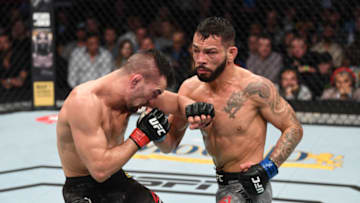 HOUSTON, TEXAS - FEBRUARY 08: (R-L) Dan Ige punches Mirsad Bektic in their featherweight bout during the UFC 247 event at Toyota Center on February 08, 2020 in Houston, Texas. (Photo by Josh Hedges/Zuffa LLC via Getty Images)