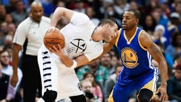 Jan 13, 2016; Denver, CO, USA; Golden State Warriors forward Andre Iguodala (9) guards Denver Nuggets forward Danilo Gallinari (8) in the third quarter at the Pepsi Center. The Nuggets defeated the Warriors 112-110. Mandatory Credit: Isaiah J. Downing-USA TODAY Sports