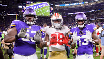 MINNEAPOLIS, MN - AUGUST 27: Dylan Bradley #63 and Stacy Coley #13 of the Minnesota Vikings pose for a photo with Adrian Colbert #38 of the San Francisco 49ers after the preseason game on August 27, 2017 at U.S. Bank Stadium in Minneapolis, Minnesota. The Vikings defeated the 49ers 32-31. (Photo by Hannah Foslien/Getty Images)