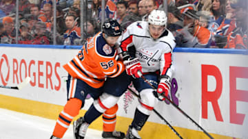 EDMONTON, AB - OCTOBER 25: Kailer Yamamoto #56 of the Edmonton Oilers battles for the puck against Dmitry Orlov #9 of the Washington Capitals on October 25, 2018 at Rogers Place in Edmonton, Alberta, Canada. (Photo by Andy Devlin/NHLI via Getty Images)