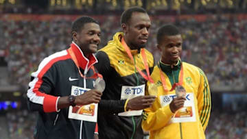 Aug 28, 2015; Beijing, China; Mens 200m gold medalist Usain Bolt (JAM), center, poses with silver medalist Justin Gatlin (USA), left, and bronze medalist Anaso Jobodwana (RSA) during the IAAF World Championships in Athletics at National Stadium. Mandatory Credit: Kirby Lee-USA TODAY Sports