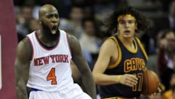 Oct 30, 2014; Cleveland, OH, USA; New York Knicks forward Quincy Acy (4) celebrates beside Cleveland Cavaliers center Anderson Varejao (17) in the fourth quarter at Quicken Loans Arena. Mandatory Credit: David Richard-USA TODAY Sports