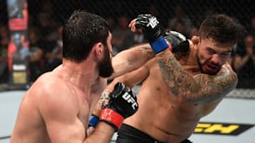 PRAGUE, CZECH REPUBLIC - FEBRUARY 23: (L-R) Magomed Ankalaev of Russia punches Klidson de Abreu of Brazil in their light heavyweight bout during the UFC Fight Night event at O2 Arena on February 23, 2019 in the Prague, Czech Republic. (Photo by Jeff Bottari/Zuffa LLC/Zuffa LLC via Getty Images)