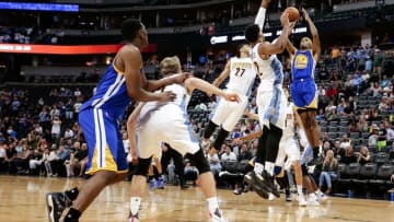 Oct 14, 2016; Denver, CO, USA; Golden State Warriors guard Patrick McCaw (0) scores the game winning basket against Denver Nuggets forward Jarnell Stokes (12) and guard Jamal Murray (27) in overtime at the Pepsi Center. The Warriors won 129-128. Mandatory Credit: Isaiah J. Downing-USA TODAY Sports