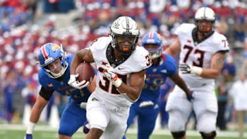 LAWRENCE, KS - SEPTEMBER 29: Running back Chuba Hubbard #30 of the Oklahoma State Cowboys runs for a 13-yard touchdown against the Kansas Jayhawks in the fourth quarter at Memorial Stadium on September 29, 2018 in Lawrence, Kansas. (Photo by Ed Zurga/Getty Images)