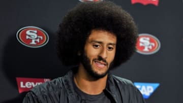 Sep 1, 2016; San Diego, CA, USA; San Francisco 49ers quarterback Colin Kaepernick (7) gestures during a press conference following the game against the San Diego Chargers at Qualcomm Stadium. San Francisco won 31-21. Mandatory Credit: Orlando Ramirez-USA TODAY Sports