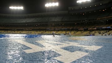 LOS ANGELES, CA - APRIL 02: The Los Angeles Dodgers logo is seen soaked with rain during a rain delay of the game against the San Francisco Giants on April 2,2008 at Dodger Stadium in Los Angeles,California. (Photo by Harry How/Getty Images)