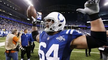 Jan 4, 2014; Indianapolis, IN, USA; Indianapolis Colts center Samson Satele (64) celebrates the victory against the Kansas City Chiefs during the 2013 AFC wild card playoff football game at Lucas Oil Stadium. Indianapolis defeats Kansas City 45-44. Mandatory Credit: Brian Spurlock-USA TODAY Sports