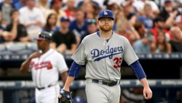 Jul 21, 2015; Atlanta, GA, USA; Los Angeles Dodgers starting pitcher Brett Anderson (35) reacts after giving up a run in the third inning of their game against the Atlanta Braves at Turner Field. Mandatory Credit: Jason Getz-USA TODAY Sports