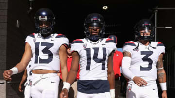 TEMPE, AZ - NOVEMBER 25: (L-R) Quarterbacks Brandon Dawkins