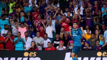 BARCELONA, SPAIN - AUGUST 13: Marco Asensio of Real Madrid CF celebrates after scoring his team's third goal during the Supercopa de Espana Supercopa Final 1st Leg match between FC Barcelona and Real Madrid at Camp Nou on August 13, 2017 in Barcelona, Spain. (Photo by Alex Caparros/Getty Images)