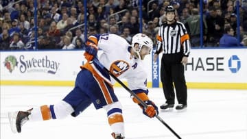 Jan 16, 2014; Tampa, FL, USA; New York Islanders defenseman Andrew MacDonald (47) shoots against the Tampa Bay Lightning during the first period at Tampa Bay Times Forum. Mandatory Credit: Kim Klement-USA TODAY Sports