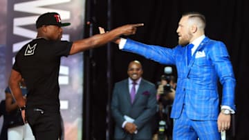 TORONTO, ON - JULY 12: Floyd Mayweather Jr. and Conor McGregor faceoff during the Floyd Mayweather Jr. v Conor McGregor World Press Tour at Budweiser Stage on July 12, 2017 in Toronto, Canada. (Photo by Vaughn Ridley/Getty Images)