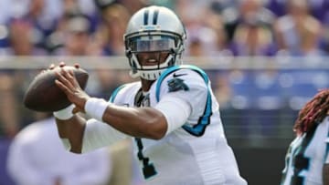 Sep 28, 2014; Baltimore, MD, USA; Carolina Panthers quarterback Cam Newton (1) throws the ball against the Baltimore Ravens at M&T Bank Stadium. Mandatory Credit: Mitch Stringer-USA TODAY Sports