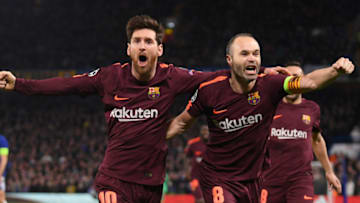 Lionel Messi of Barcelona celebrates his equaliser with team mate Andres Iniesta. (Photo by Mike Hewitt/Getty Images)