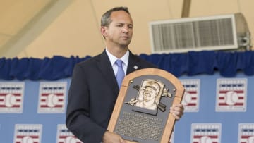 Jul 24, 2016; Cooperstown, NY, USA; Hall of Fame President Jeff Idelson holds Ken Griffey Jr.