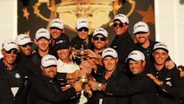 CHASKA, MN - OCTOBER 02: Matt Kuchar, Dustin Johnson, Brandt Snedeker, Ryan Moore, Davis Love III, Brooks Koepka, Zach Johnson, J.B. Holmes, Jordan Spieth, Phil Mickelson, Jimmy Walker and Rickie Fowler of the United States celebrate during the closing ceremony of the 2016 Ryder Cup at Hazeltine National Golf Club on October 2, 2016 in Chaska, Minnesota. (Photo by Streeter Lecka/Getty Images)