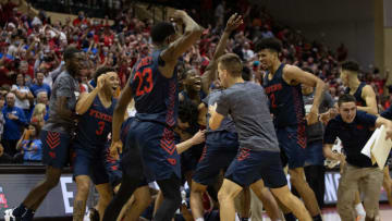 Nov 26, 2021; Orlando, FL, USA; Dayton Flyers celebrate a victory over the Kansas Jayhawks after regulation at HP Fieldhouse Mandatory Credit: Jeremy Reper-USA TODAY Sports