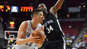 LAS VEGAS, NV - JULY 07: TJ Leaf #22 of the Indiana Pacers drives against Cory Jefferson #34 of the San Antonio Spurs during the 2018 NBA Summer League at the Thomas & Mack Center on July 7, 2018 in Las Vegas, Nevada. NOTE TO USER: User expressly acknowledges and agrees that, by downloading and or using this photograph, User is consenting to the terms and conditions of the Getty Images License Agreement. (Photo by Sam Wasson/Getty Images)