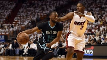 May 1, 2016; Miami, FL, USA; Charlotte Hornets guard Kemba Walker (15) drives to the basket as Miami Heat forward Joe Johnson (2) defends during the first half in game seven of the first round of the NBA Playoffs at American Airlines Arena. Mandatory Credit: Steve Mitchell-USA TODAY Sports