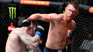 LAS VEGAS, NEVADA - AUGUST 28: (R-L) Sam Alvey punches Wellington Turman of Brazil in a middleweight fight during the UFC Fight Night event at UFC APEX on August 28, 2021 in Las Vegas, Nevada. (Photo by Chris Unger/Zuffa LLC)