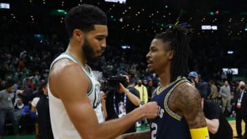 Boston Celtics forward Jayson Tatum (0) greets Memphis Grizzlies guard Ja Morant (12) Mandatory Credit: Winslow Townson-USA TODAY Sports