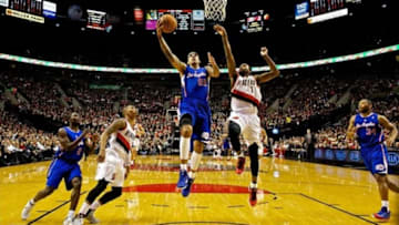 Dec 26, 2013; Portland, OR, USA; Los Angeles Clippers small forward Matt Barnes (22) shoots over Portland Trail Blazers small forward Dorell Wright (1) at the Moda Center. Mandatory Credit: Craig Mitchelldyer-USA TODAY Sports