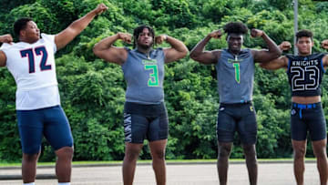 Auburn footballVysen Lang of Pike Road, from left, James Smith and Qua Russaw from Carver, and Jeremiah Cobb from Catholic are shown in Montgomery, Ala., on Sunday August 7, 2022.Fab04