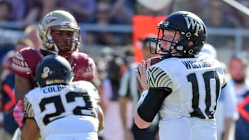 Oct 15, 2016; Tallahassee, FL, USA; Florida State Seminoles defense tries to pressure Wake Forest Demon Deacons quarterback John Wolford (10) during the game at Doak Campbell Stadium. Mandatory Credit: Melina Vastola-USA TODAY Sports