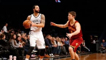 Jan 4, 2014; Brooklyn, NY, USA; Brooklyn Nets point guard Deron Williams (8) controls the ball in front of Cleveland Cavaliers shooting guard Matthew Dellavedova (9) during the third quarter at Barclays Center. Brooklyn Nets won 89-82. Mandatory Credit: Anthony Gruppuso-USA TODAY Sports