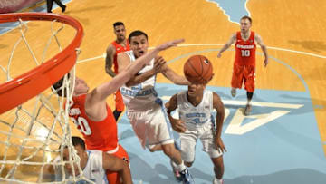 Feb 29, 2016; Chapel Hill, NC, USA; North Carolina Tar Heels guard Marcus Paige (5) shoots as Syracuse Orange forward Tyler Lydon (20) defends in the second half. The Tar Heels defeated Syracuse Orange 75-70 at Dean E Smith Center. Mandatory Credit: Bob Donnan-USA TODAY Sports