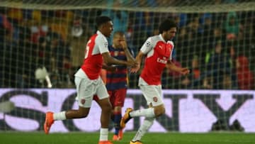 BARCELONA, SPAIN - MARCH 16: Mohamed Elneny of Arsenal celebrates scoring with Alex Iwobi of Arsenal during the UEFA Champions League Round of 16 Second Leg match between FC Barcelona and Arsenal FC at Camp Nou on March 16, 2016 in Barcelona,Spain. (Photo by Ian MacNicol/Getty Images)