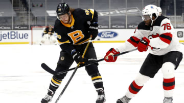 BOSTON, MASSACHUSETTS - FEBRUARY 18: P.K. Subban #76 of the New Jersey Devils defends David Pastrnak #88 of the Boston Bruins during the first period at TD Garden on February 18, 2021 in Boston, Massachusetts. (Photo by Maddie Meyer/Getty Images)