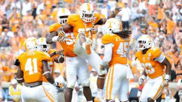 Tennessee defensive back Brian Randolph (37), center, celebrates with teammates after his interception to stop South Alabama's final drive to score in Tennessee's 31-24 victory at Neyland Stadium in Knoxville on Saturday, Sept. 28, 2013.0929 Kcsp Utsa 2230 Al