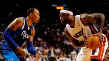 Nov 15, 2013; Miami, FL, USA; Miami Heat small forward LeBron James (6) is pressured by Dallas Mavericks small forward Shawn Marion (0) during the second half at American Airlines Arena. Mandatory Credit: Steve Mitchell-USA TODAY Sports