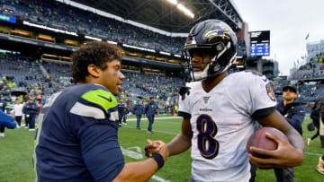 SEATTLE, WASHINGTON - OCTOBER 20: Russell Wilson #3 of the Seattle Seahawks and Lamar Jackson #8 of the Baltimore Ravens shake hands after the game at CenturyLink Field on October 20, 2019 in Seattle, Washington. The Baltimore Ravens top the Seattle Seahawks 30-16. (Photo by Alika Jenner/Getty Images)