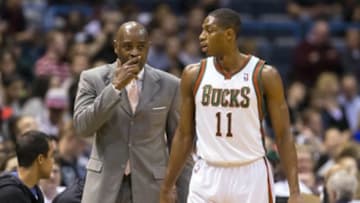 Apr 16, 2014; Milwaukee, WI, USA; Milwaukee Bucks head coach Larry Drew talks with guard Brandon Knight (11) during the first quarter against the Atlanta Hawks at BMO Harris Bradley Center. Mandatory Credit: Jeff Hanisch-USA TODAY Sports