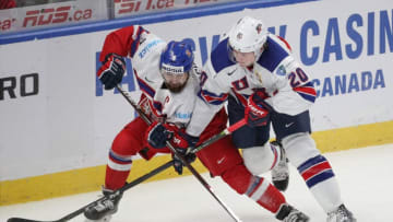 BUFFALO, NY - JANUARY 05: Marek Zachar #6 of Czech Republic battles with Andrew Peeke #20 of United States during the second period of play in the IIHF World Junior Championships Bronze Medal game at KeyBank Center on January 5, 2018 in Buffalo, New York. (Photo by Nicholas T. LoVerde/Getty Images)