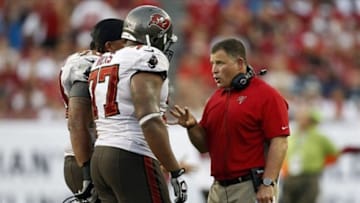 Sept. 9, 2012; Tampa FL, USA; Tampa Bay Buccaneers head coach Greg Schiano talks with guard Carl Nicks against the Carolina Panthers during the second half at Raymond James Stadium. The Buccaneers defeated the Panthers 16-10. Mandatory Credit: Matt Stamey-USA TODAY Sports