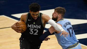 MINNEAPOLIS, MINNESOTA - MAY 05: Jonas Valanciunas #17 of the Memphis Grizzlies defends against Karl-Anthony Towns #32 of the Minnesota Timberwolves during the first quarter of the game at Target Center on May 5, 2021 in Minneapolis, Minnesota. NOTE TO USER: User expressly acknowledges and agrees that, by downloading and or using this Photograph, user is consenting to the terms and conditions of the Getty Images License Agreement (Photo by Hannah Foslien/Getty Images)