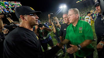 SOUTH BEND, IN - SEPTEMBER 01: Michigan Wolverines head coach Jim Harbaugh shakes hands with Notre Dame Fighting Irish head coach Brian Kelly after the game between the Michigan Wolverines and the Notre Dame Fighting Irish on September 1, 2018 at Notre Dame Stadium, in South Bend, Indiana. The Notre Dame Fighting Irish defeated the Michigan Wolverines by the score of 24-17. (Photo by Robin Alam/Icon Sportswire via Getty Images)