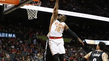 Jan 16, 2016; Atlanta, GA, USA; Atlanta Hawks guard Tim Hardaway Jr. (10) dunks against Brooklyn Nets guard Bojan Bogdanovic (44) in the fourth quarter at Philips Arena. The Hawks won 114-86. Mandatory Credit: Jason Getz-USA TODAY Sports