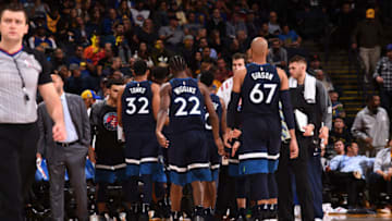 OAKLAND, CA - NOVEMBER 8: Karl-Anthony Towns #32, Andrew Wiggins #22, and Taj Gibson #67 of the Minnesota Timberwolves meet with team during game against the Golden State Warriors on November 8, 2017 at ORACLE Arena in Oakland, California. NOTE TO USER: User expressly acknowledges and agrees that, by downloading and or using this photograph, user is consenting to the terms and conditions of Getty Images License Agreement. Mandatory Copyright Notice: Copyright 2017 NBAE (Photo by Noah Graham/NBAE via Getty Images)